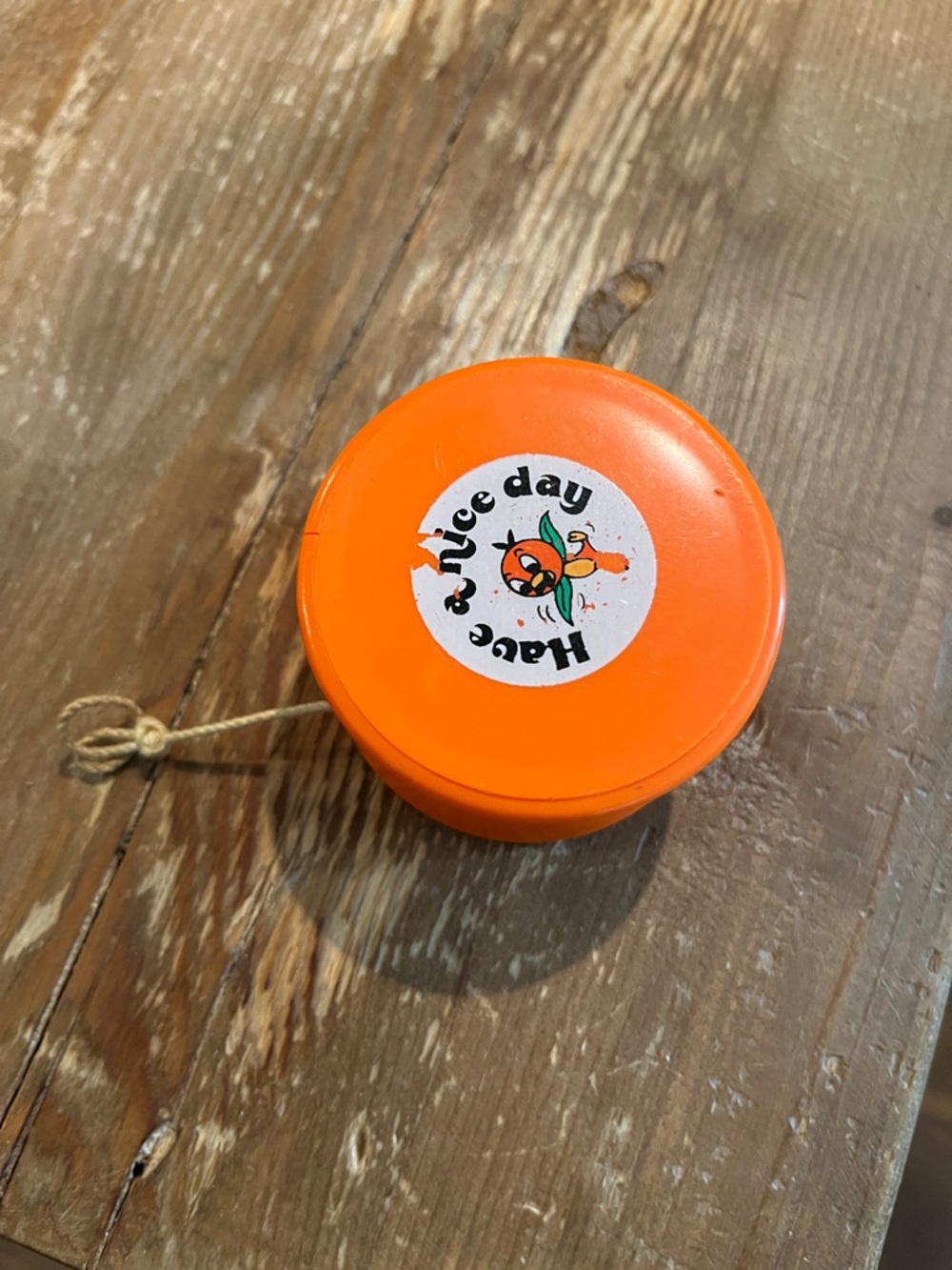 Vintage Walt Disney Orange Yo-Yo with 'Have a Nice Day' Graphic